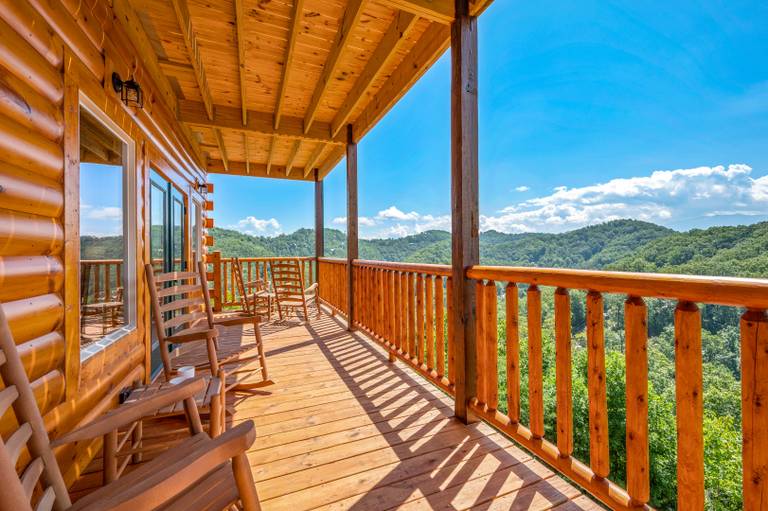 deck overlooking smoky mountains at cloud splash vacation rental