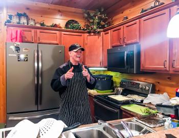 Photo of Chef Ray in the kitchen giving a thumbs up.