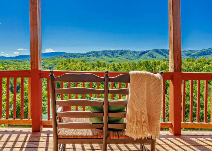 rocking chair on a deck overlooking the smoky mountains 