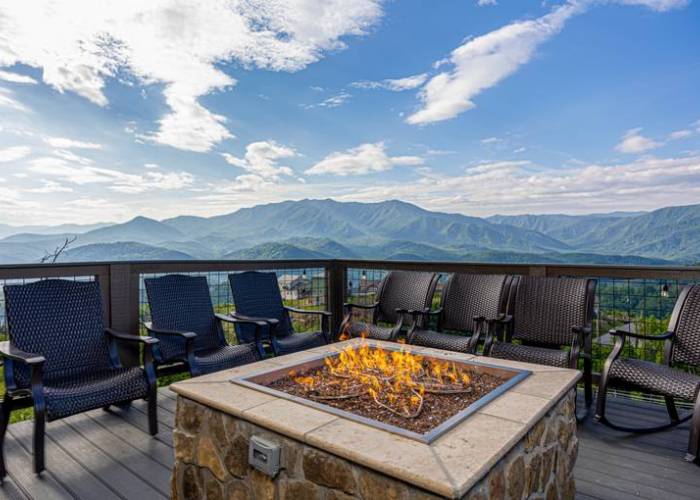 Fireplace on a deck with mountain views 