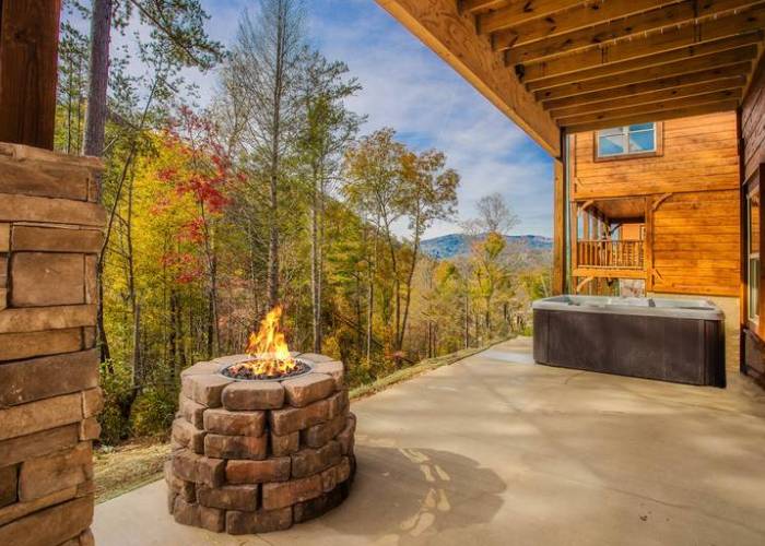 A fireplace behind a smoky mountain vacation cabin