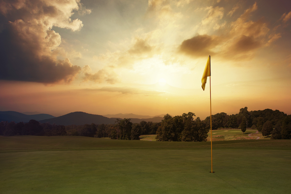 golfing in the summer in the mountains, sunset on a mountain golf course